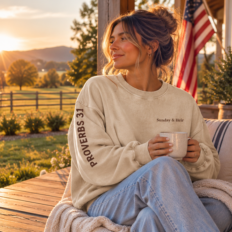 Apricot Proverbs 31 Sunday & Heir sweatshirt with chocolate lettering, seated with coffee at farmhouse